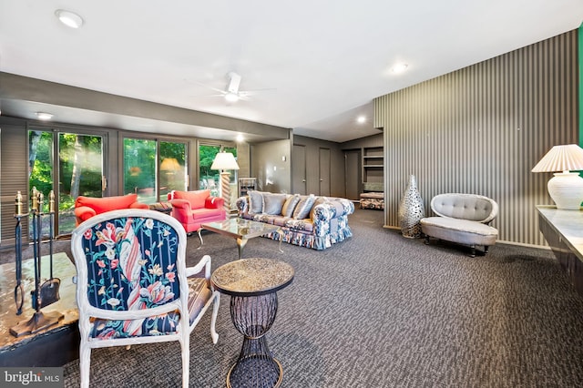 carpeted living room featuring ceiling fan