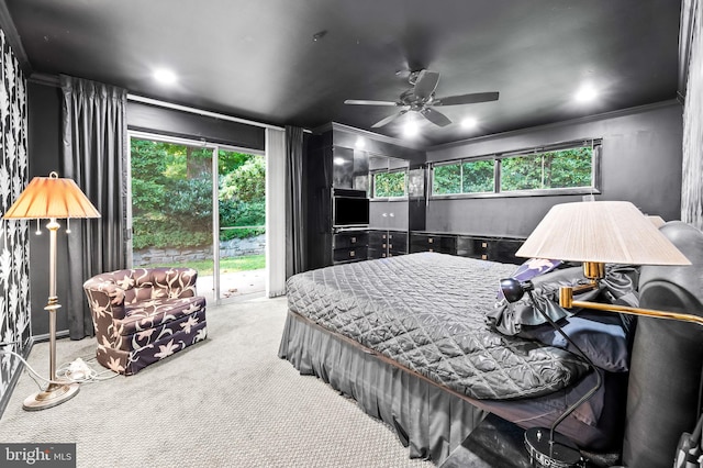 carpeted bedroom featuring access to outside, ornamental molding, and ceiling fan