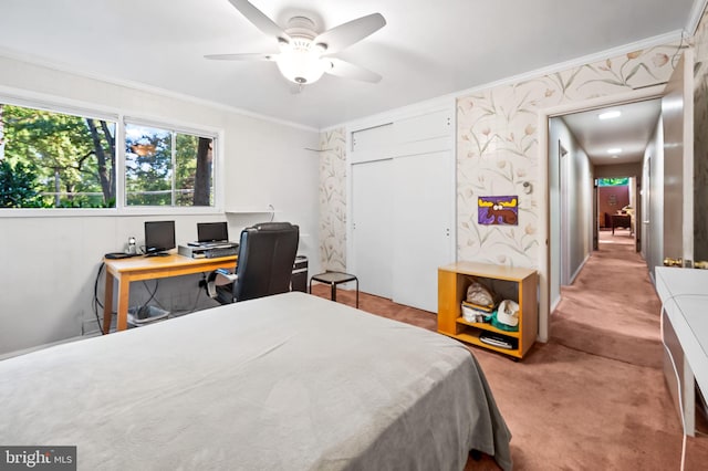 bedroom with ornamental molding, ceiling fan, and light colored carpet