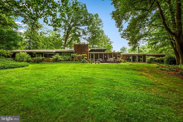 view of yard featuring a sunroom