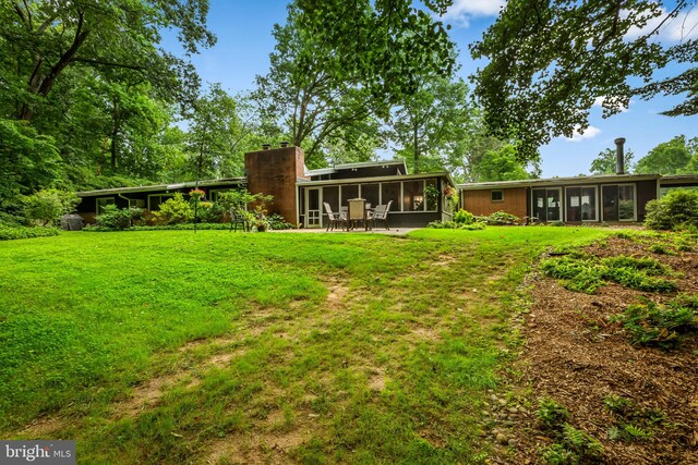 view of yard with a sunroom