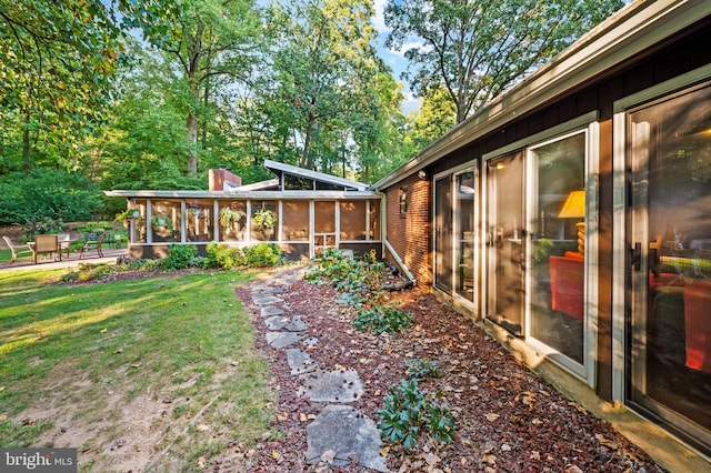 view of yard with a sunroom