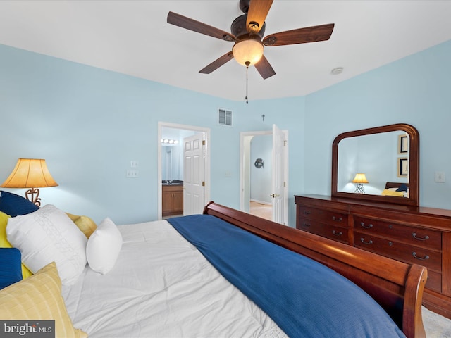 bedroom with ensuite bath and ceiling fan