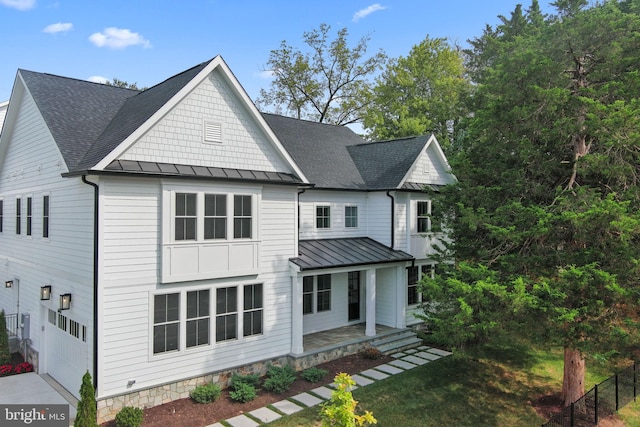 view of front of property featuring a garage and covered porch