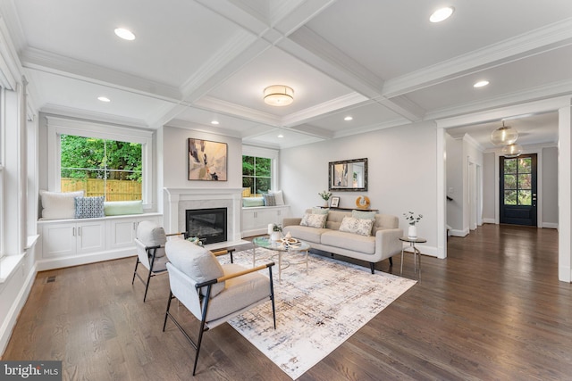 living room featuring beam ceiling, a premium fireplace, coffered ceiling, and dark hardwood / wood-style flooring