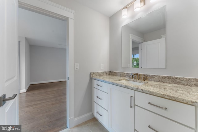 bathroom with wood-type flooring and vanity