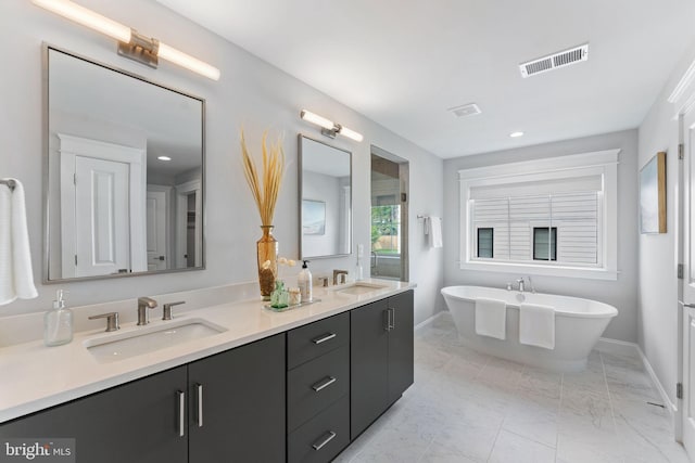 bathroom featuring vanity and a bathing tub