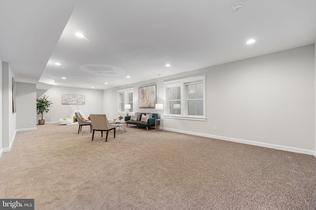 living area featuring light colored carpet