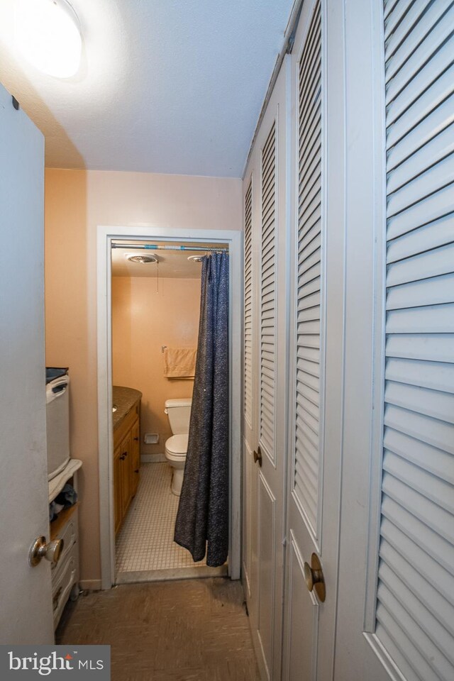 bathroom with vanity and toilet