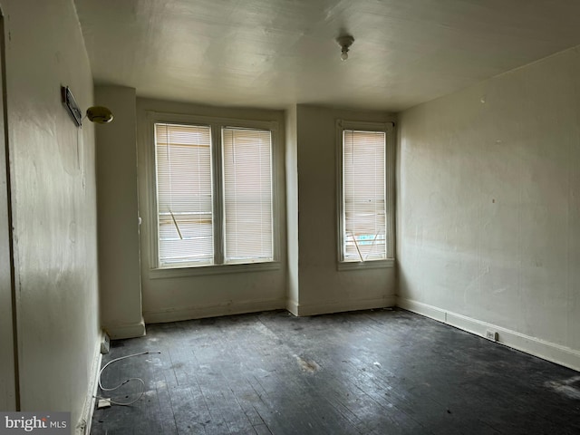 spare room with hardwood / wood-style flooring