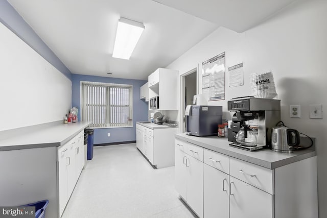 kitchen with sink and white cabinetry