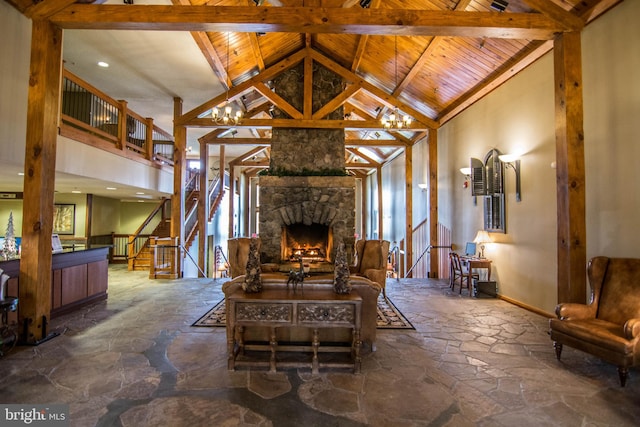 living room featuring high vaulted ceiling, wooden ceiling, beamed ceiling, and a fireplace