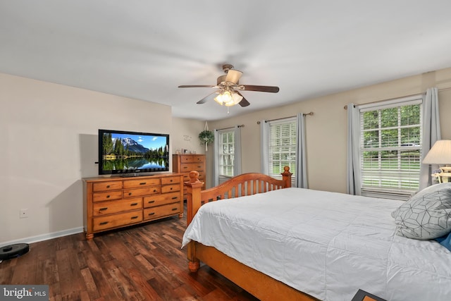 bedroom featuring ceiling fan and dark hardwood / wood-style flooring