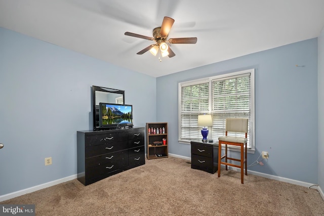 interior space featuring light carpet and ceiling fan