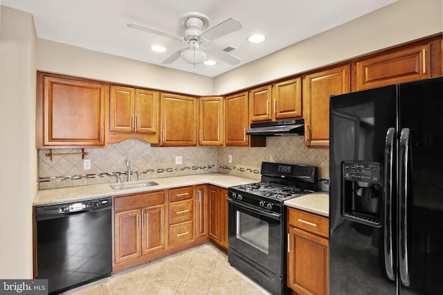 kitchen with decorative backsplash, sink, ceiling fan, and black appliances