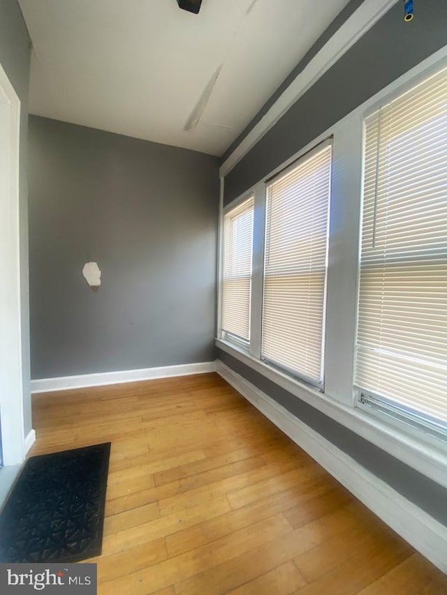 unfurnished room featuring hardwood / wood-style flooring