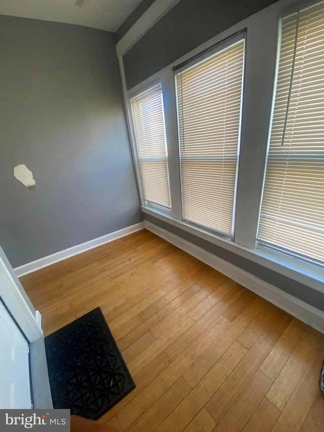 empty room with light hardwood / wood-style floors