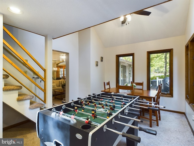 playroom with carpet flooring, lofted ceiling, and a textured ceiling