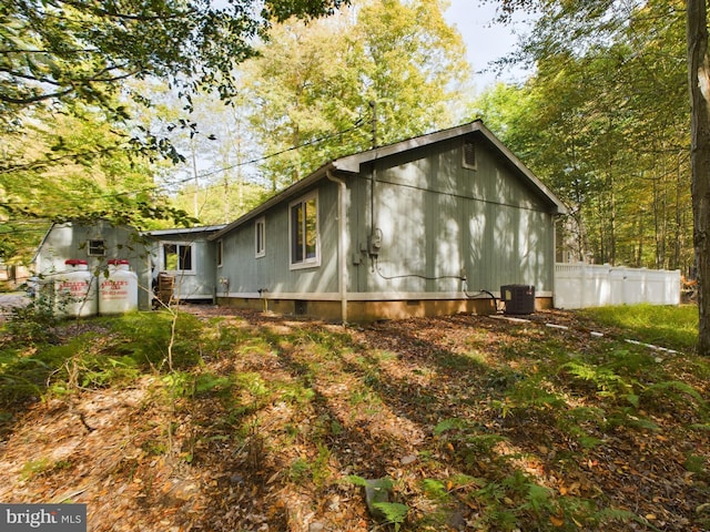 view of side of home featuring central air condition unit