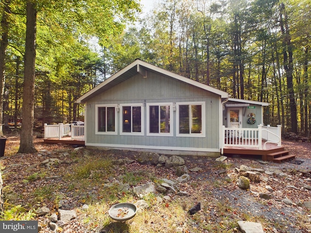 view of side of property with a wooden deck