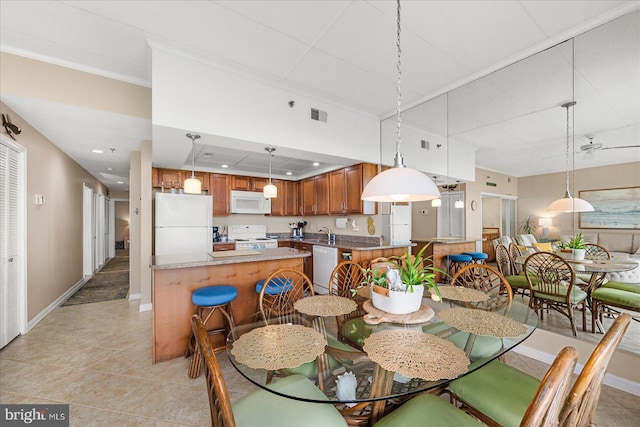 110 81st St Unit G03, Ocean City, MD 21842 - dining area featuring light tile patterned floors, baseboards, crown molding, and recessed lighting