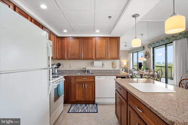 110 81st St Unit G03, Ocean City, MD 21842 - kitchen with white appliances, a sink, recessed lighting, brown cabinetry, and pendant lighting