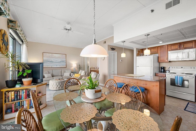 110 81st St Unit G03, Ocean City, MD 21842 - dining room featuring a ceiling fan, light tile patterned floors, and coffered ceiling