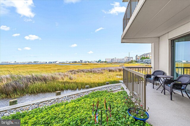 110 81st St Unit G03, Ocean City, MD 21842 - view of yard with a balcony
