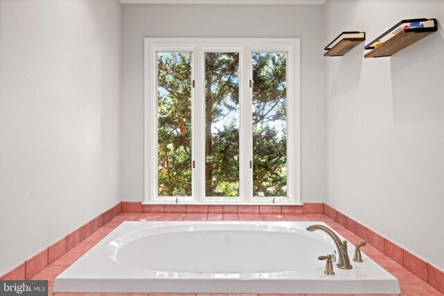 bathroom featuring tiled bath