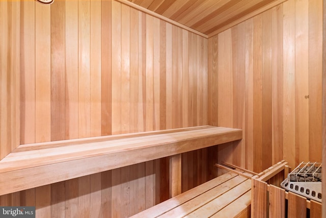 view of sauna / steam room with wooden walls and wooden ceiling