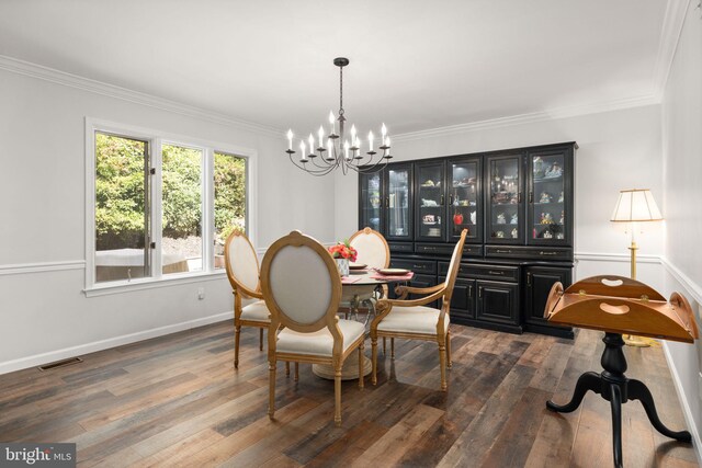 dining room featuring a notable chandelier, dark hardwood / wood-style floors, and ornamental molding