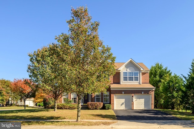 view of property hidden behind natural elements featuring a garage and a front lawn