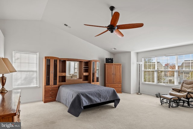 carpeted bedroom featuring ceiling fan and vaulted ceiling