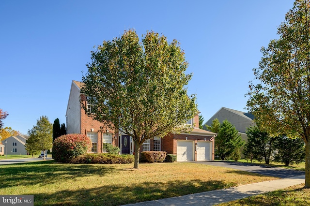 obstructed view of property with a front lawn