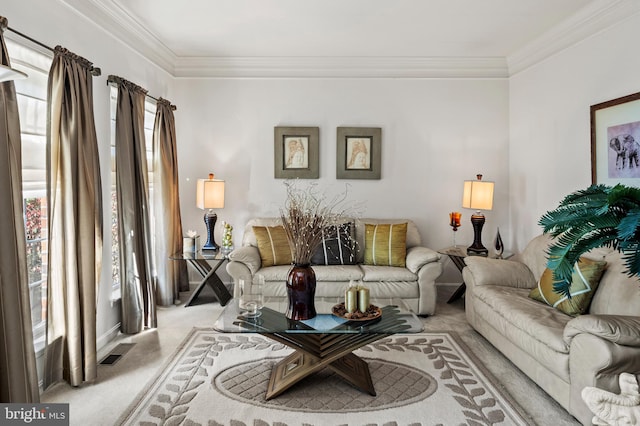 carpeted living room with crown molding and a healthy amount of sunlight