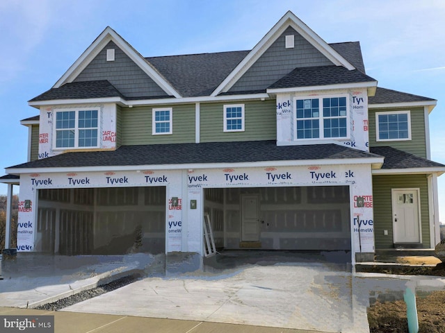 view of front of property with a garage