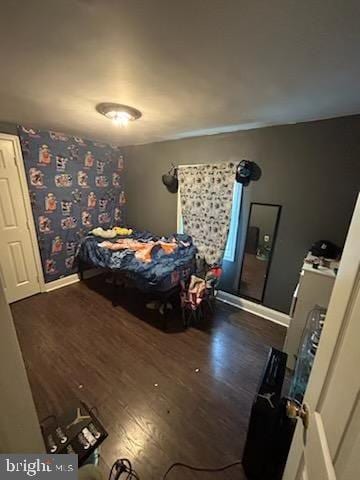 bedroom featuring dark hardwood / wood-style floors