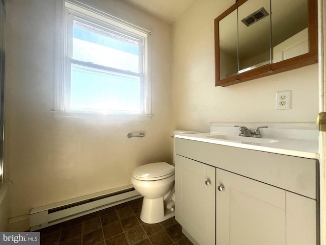 bathroom with vanity, toilet, and a baseboard radiator