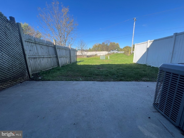 view of yard with a patio area and central AC