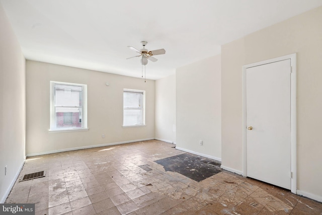 spare room with ceiling fan