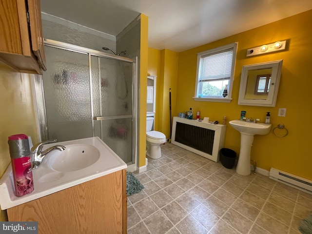 bathroom featuring a baseboard radiator, a shower with door, toilet, sink, and tile patterned floors