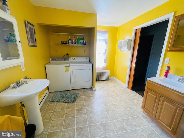 bathroom with radiator and washer and dryer