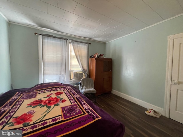 bedroom featuring crown molding and hardwood / wood-style floors