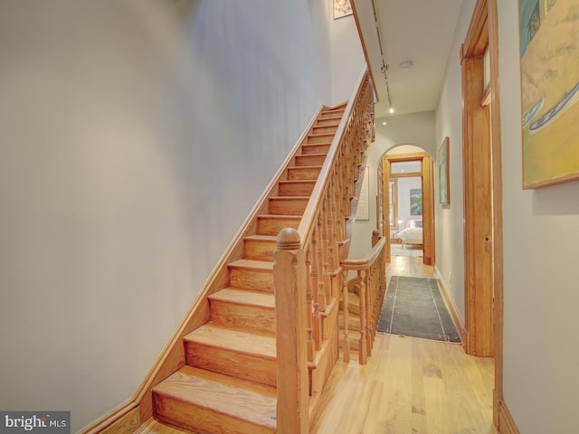 staircase featuring hardwood / wood-style flooring