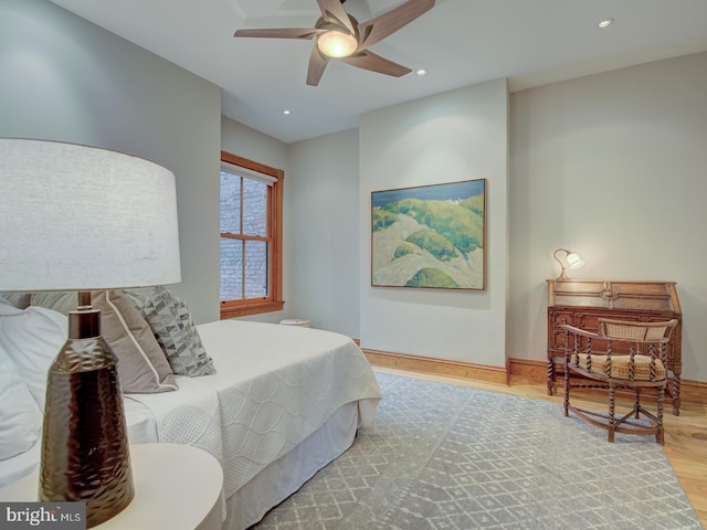 bedroom featuring light wood-type flooring and ceiling fan