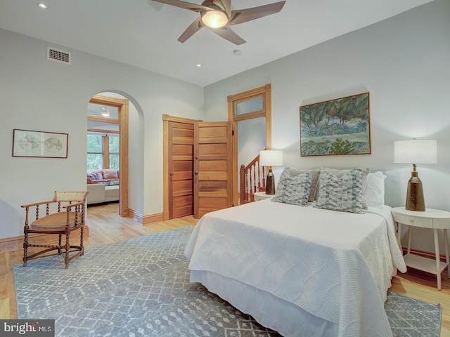 bedroom featuring light wood-type flooring and ceiling fan