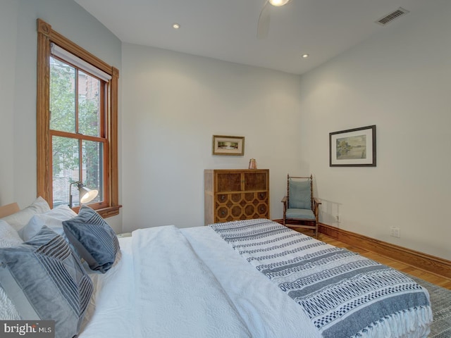 bedroom featuring wood-type flooring and ceiling fan