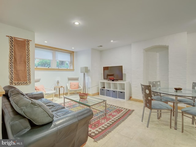 living room with light tile patterned flooring