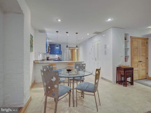 dining area featuring sink