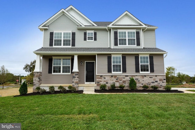 craftsman-style home featuring a front yard